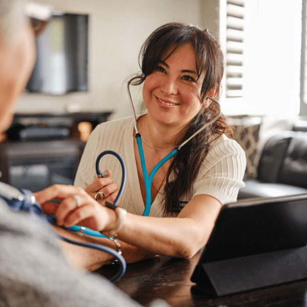 An at-home nurse visiting an elderly patient