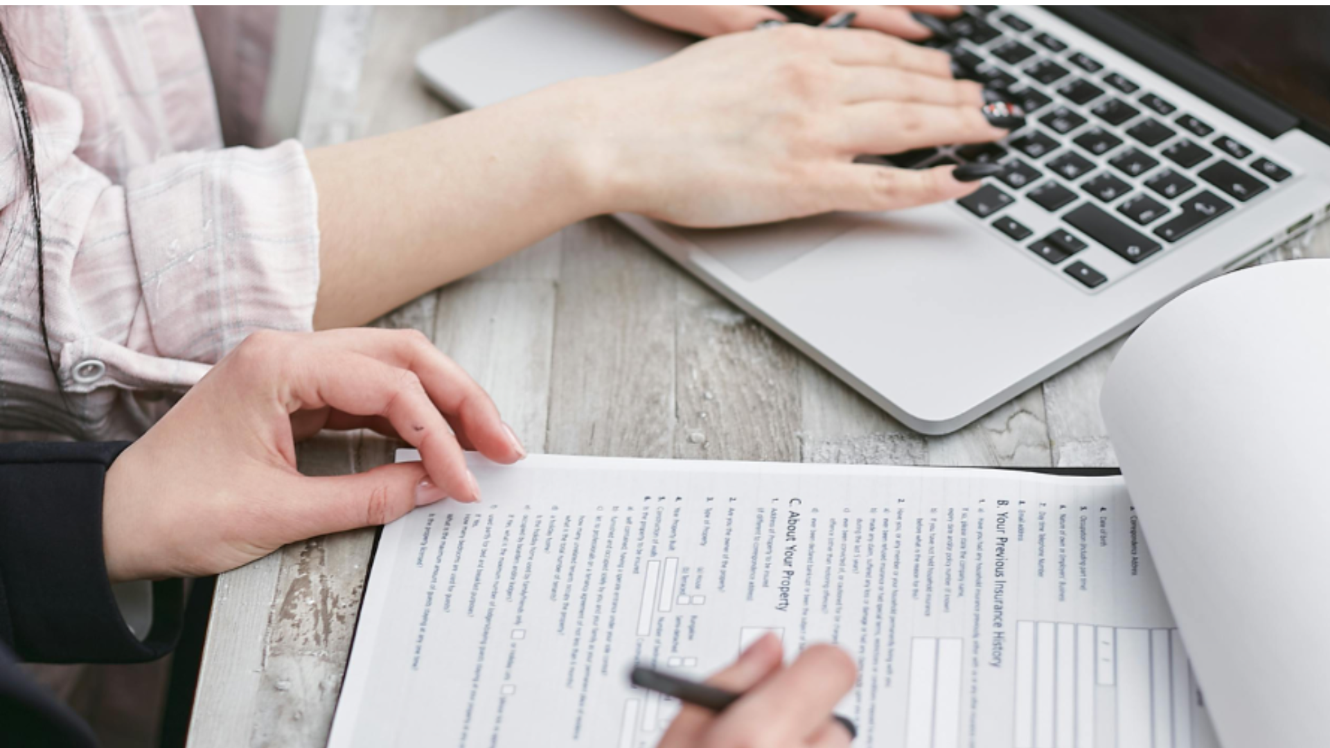 peope looking at cyber insurance paperwork