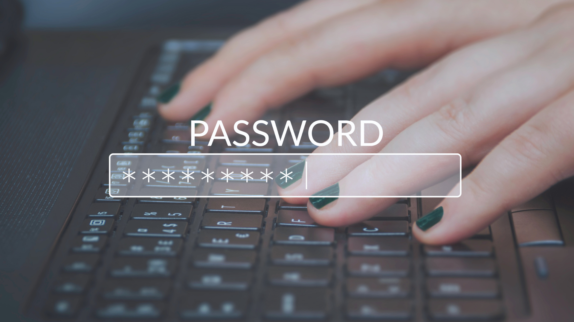 hands typing in a password on a laptop