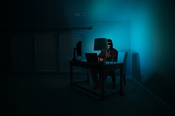 An anonymous guy using a computer