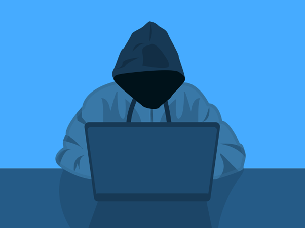 hooded figure with laptop