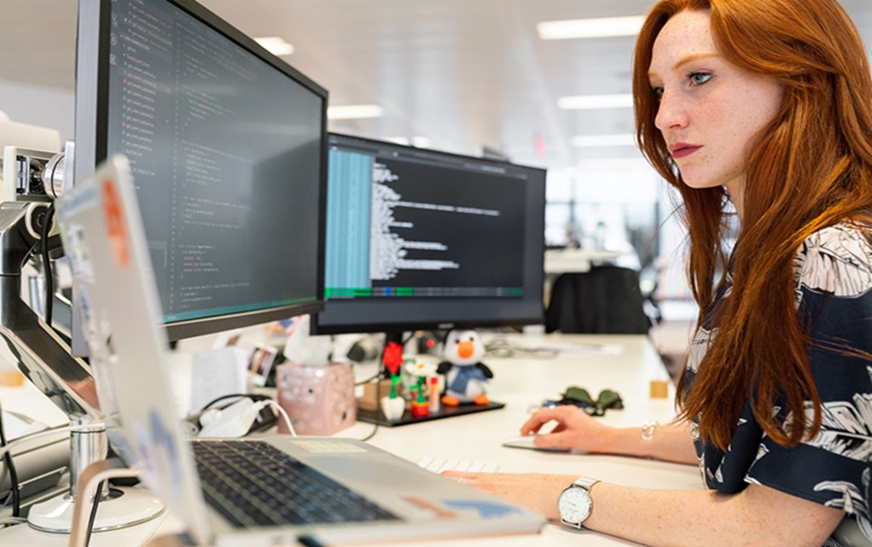 An employee using her work computer